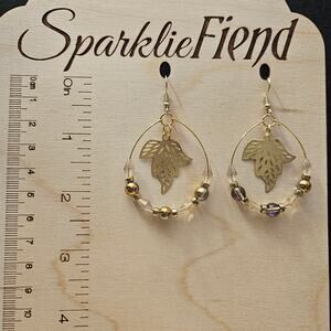 Goldtone filigree and glass crystal teardrop hoop earrings